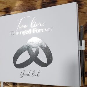 Beautiful white wedding guest book with silver foil accents