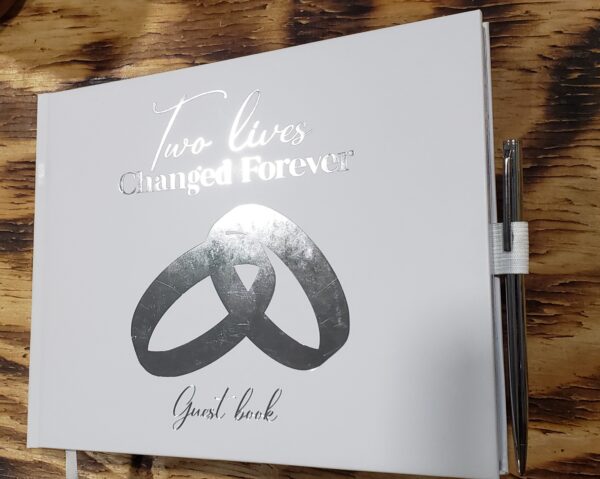 Beautiful white wedding guest book with silver foil accents